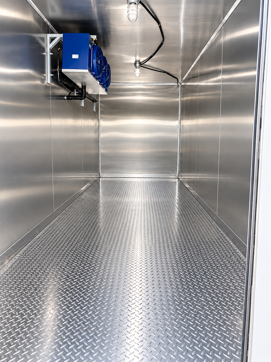 Stainless steel cold-storage interior of a 20 ft refrigerated trailer