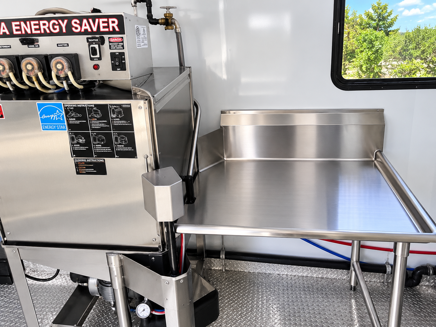 Commercial dishwasher inside a 22 to 26 ft dishwashing trailer