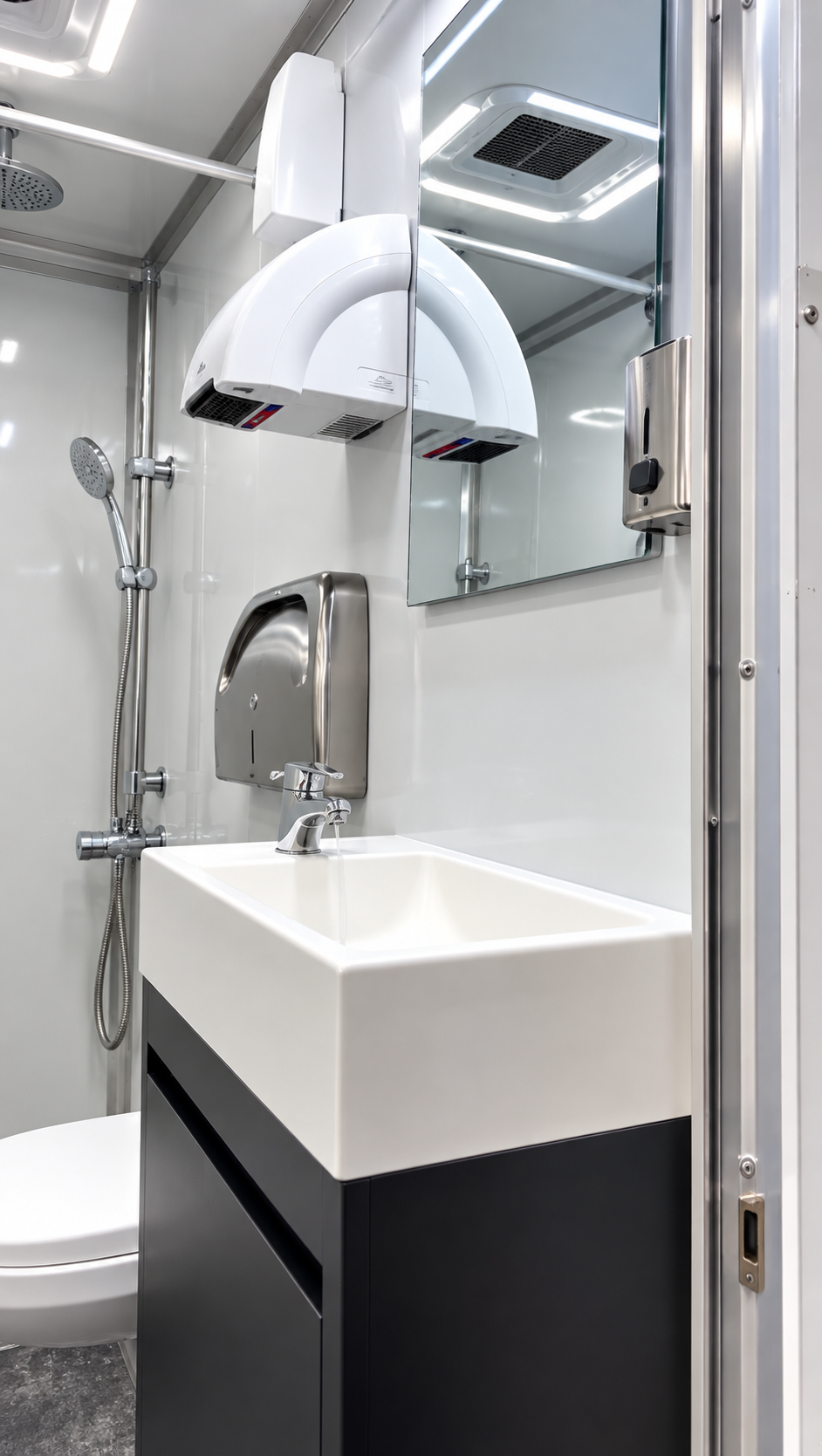 Sink and vanity interior of a 22 ft six-stall shower and restroom combination trailer