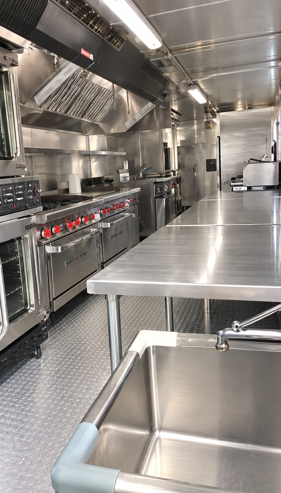 Stainless cooking and preparation area inside a 40 ft mobile commercial kitchen