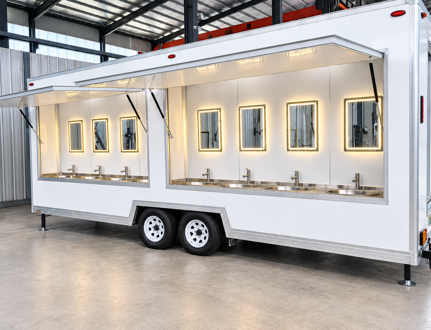 Portable handwashing trailer with multiple sinks under an open service canopy